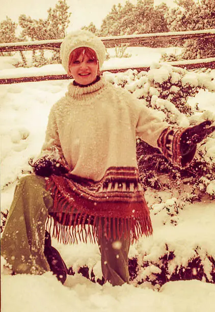 Vintage image of a woman playing under the snow
