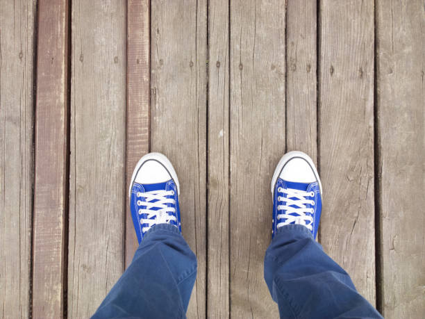 istock Feet on the painted boards. 852697118