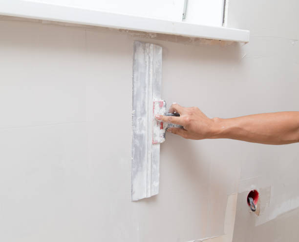 istock the worker plastered the mortar on the wall 852710562