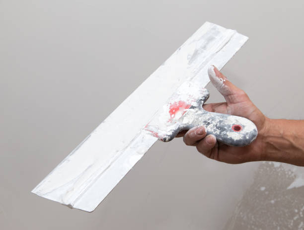 istock the worker plastered the mortar on the wall 852710614