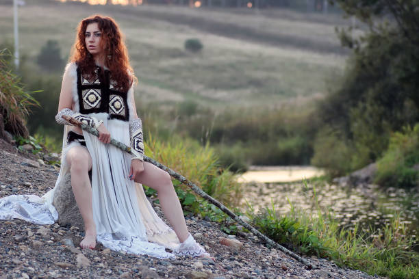 istock girl with spear at the river 852731924