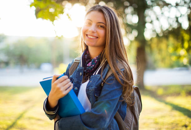 istock Portrait of female university student outdoors on campus 852732102