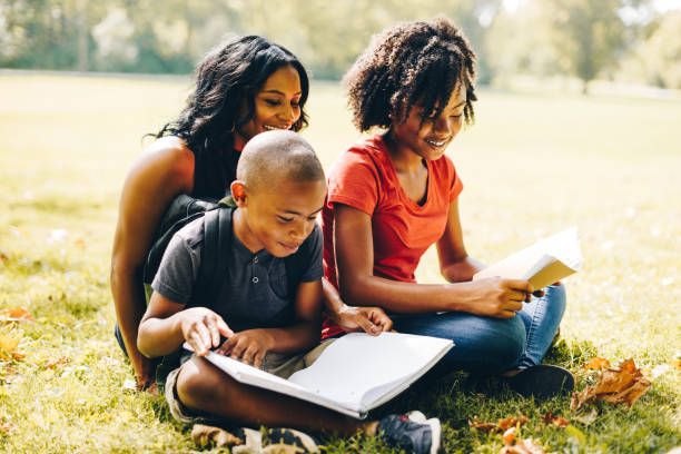 istock mother helping the kids doing the homework 852732360