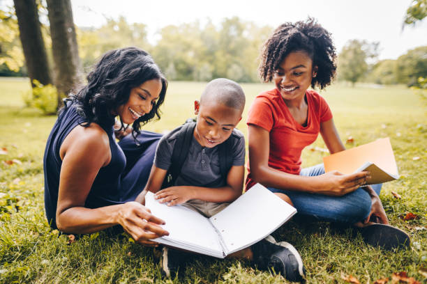 istock mother helping the kids doing the homework 852732772