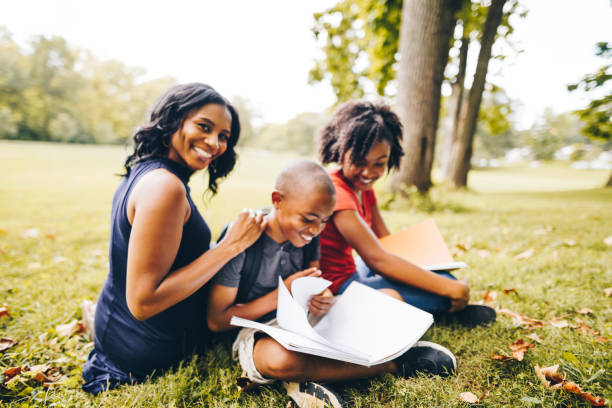 istock mother helping the kids doing the homework 852733318
