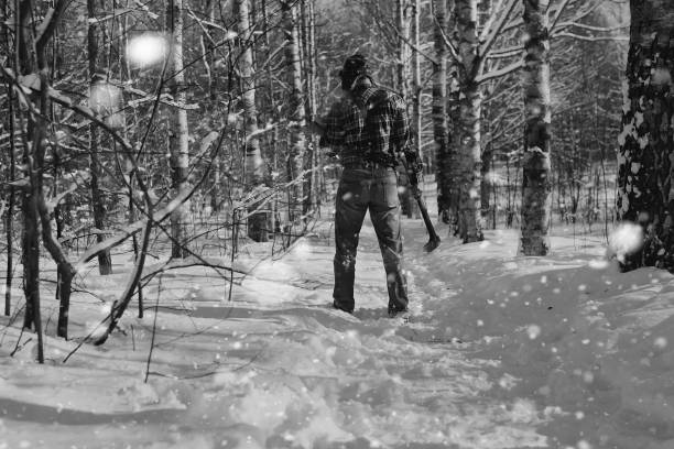 istock monochrome landscape man with axe 852739750