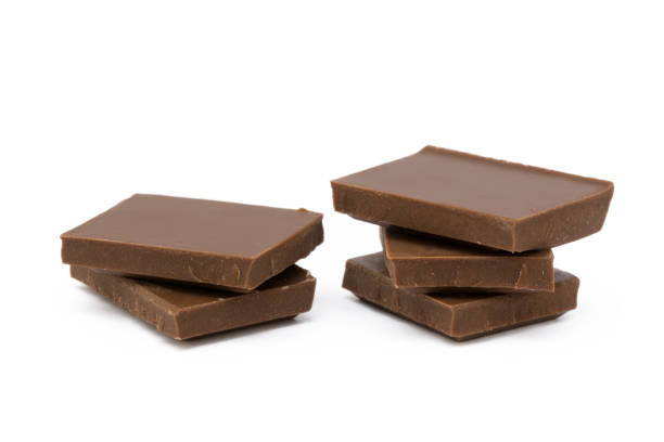 istock Milk chocolate pieces isolated on white background 852742980