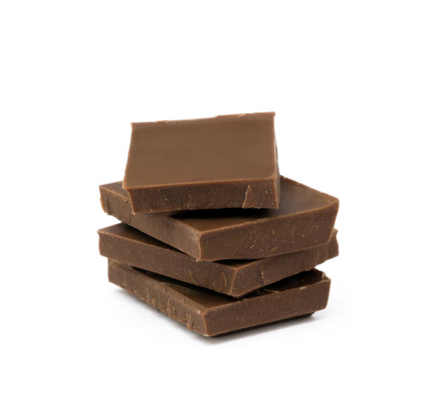 istock Milk chocolate pieces isolated on white background 852743050