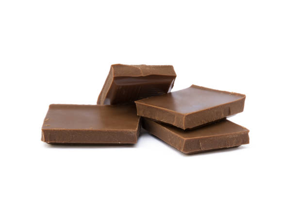 istock Milk chocolate pieces isolated on white background 852743068