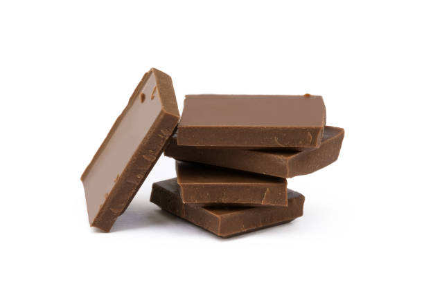 istock Milk chocolate pieces isolated on white background 852743114