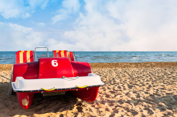 Colorful of pedalo parked on the beach
