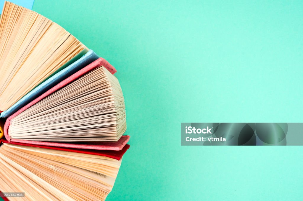 Top view of bright colorful hardback books in a circle. Top view of colorful hardback books in a circle. free copy space. Back to school copy space. Education background. Book Stock Photo