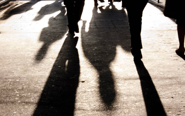 istock Defocused shadow and silhouette of people on the sidewalk 852764836