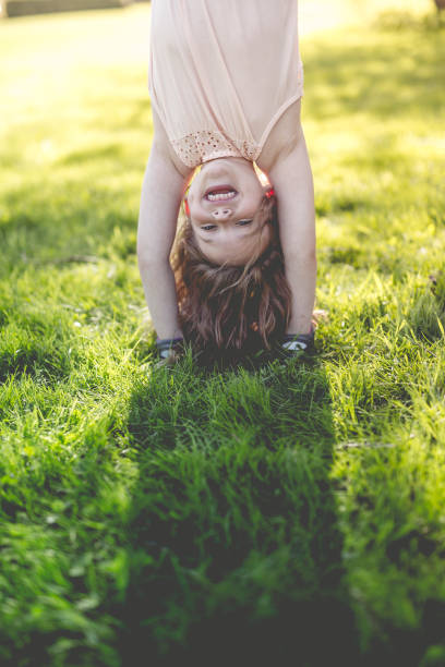 istock Happy child playing on green grass outdoors in spring park 852764952