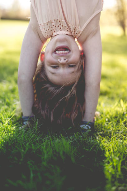 istock Happy child playing on green grass outdoors in spring park 852765122