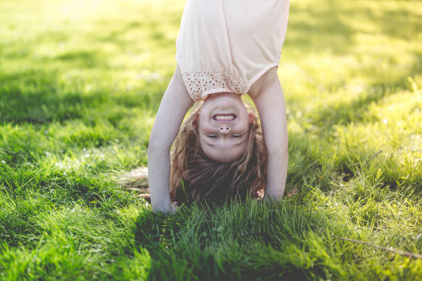 istock Happy child playing on green grass outdoors in spring park 852765206