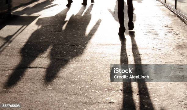 Blurry Shadows And Silhouettes On City Sidewalk Stock Photo - Download Image Now - Crowd of People, Loneliness, Abstract