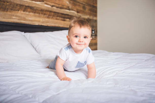 istock Cute Baby boy in white bedding 852765864