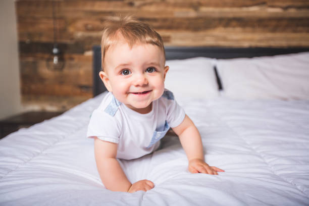 istock Cute Baby boy in white bedding 852765964