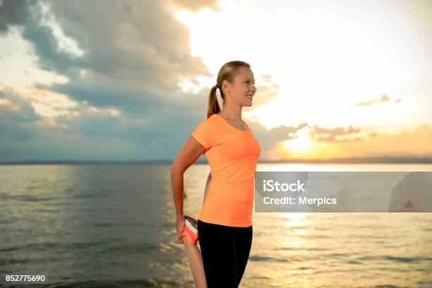 Stretching Woman Stock Photo - Download Image Now - Active Lifestyle, Adult, Adults Only