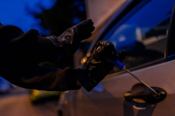 istock Unrecognizable Person Breaking car at night 852775834