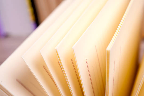 istock Open book, hardback books on bright colorful background. 852780174
