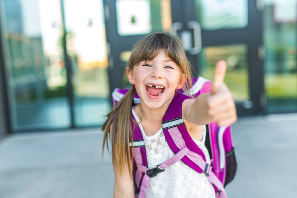 istock Girl Standing Outside School With Bag 852792306