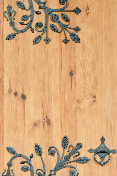 istock Wooden door with wrought metal elements 852792556