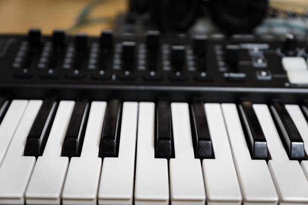 istock MIDI keyboard synthesizer piano keys closeup 852807220