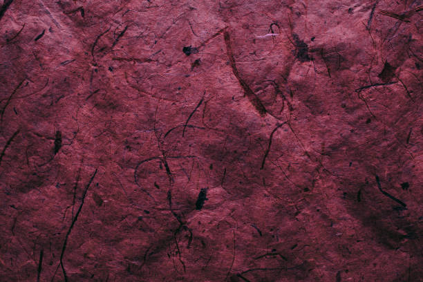Abstract red texture and background for designers. Vintage paper background. Rough red texture of recycled paper. Closeup view of abstract red texture. Vintage red paper. Red vintage background made with recycled paper perfect for designers and graphic design.