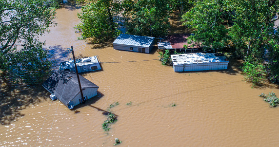 homes under water after Hurricane Harvey an aerial view of the destruction we see year after year as Hurricanes and natural disasters increase and get worse and worse every year. The Future will bring more floods and Climate Change will continue to get worse