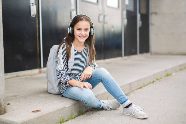 istock Elementary school pupil outside carrying rucksack 852830054