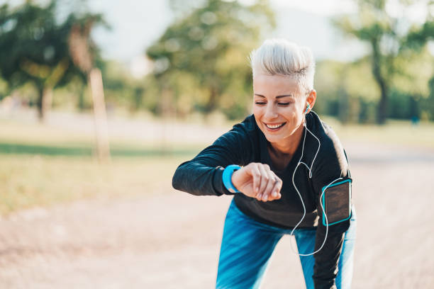 istock Sportswoman looking at her smart watch 852840616