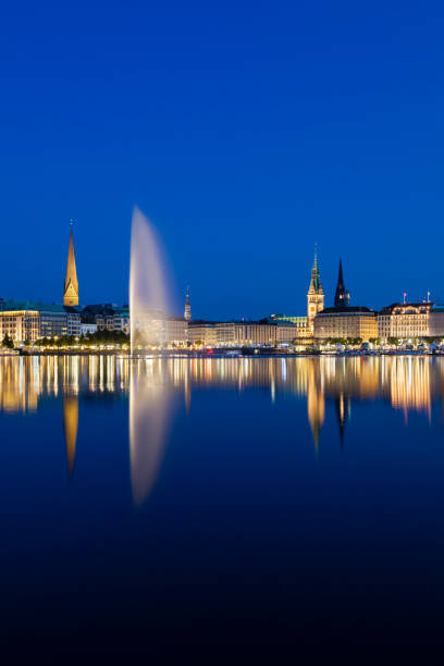 The famous Binnenalster lake with its fountain in Hamburg, Germany at night