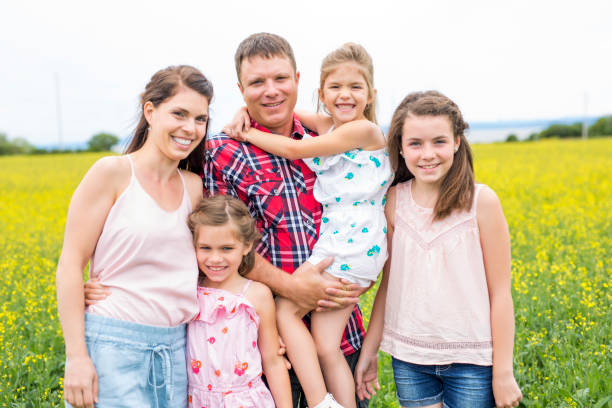 istock Family outdoors on a yellow field 852843740