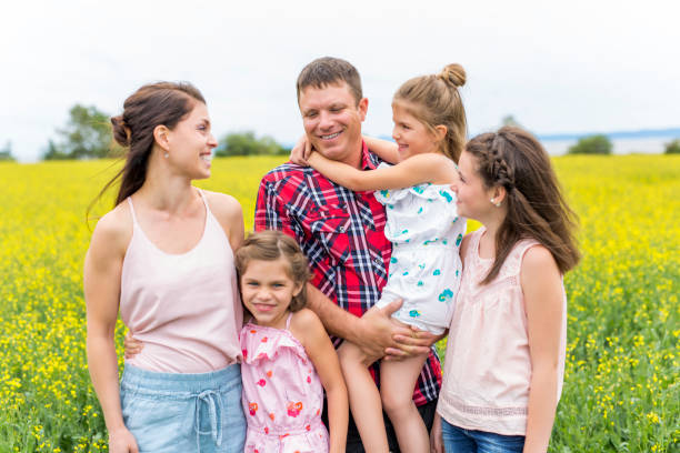 istock Family outdoors on a yellow field 852843916