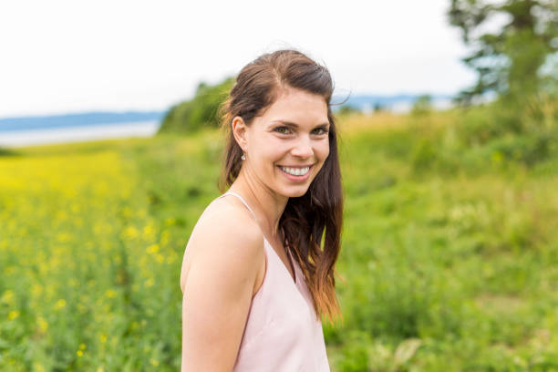 istock Happy young woman over yellow meadow 852854180