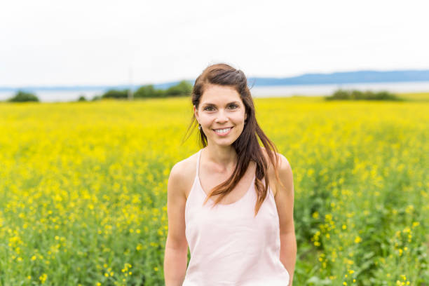 istock Happy young woman over yellow meadow 852854348