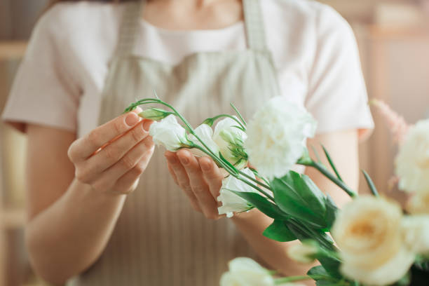 istock Young woman florist occupation working with flowers 852861832