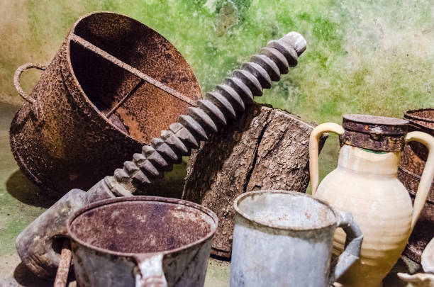 Rusty tools in an ancient underground oil mill in Salento, Italy