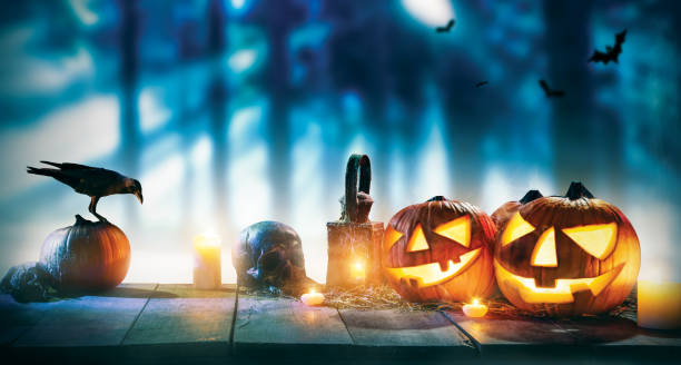 istock Spooky halloween pumpkins on wooden planks 852862392