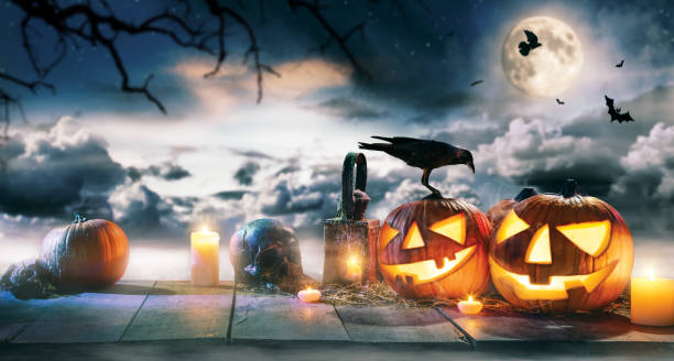 istock Spooky halloween pumpkins on wooden planks 852862534