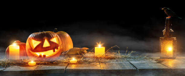 istock Spooky halloween pumpkins on wooden planks 852862662