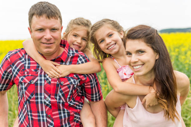 istock Family outdoors on a yellow field 852863046