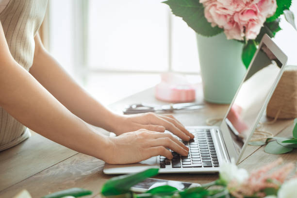 istock Young woman florist occupation working with flowers 852871526