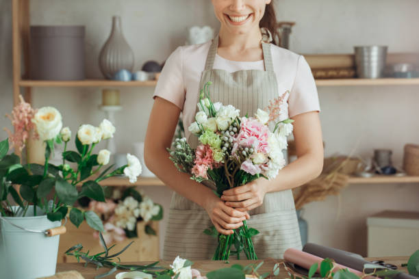 istock Young woman florist occupation working with flowers 852872074