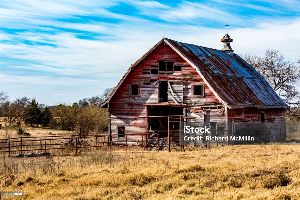 Old Abandonded Red Barn in Oklahoma Rural Oklahoma Farmland with Old Run-down Abanonded Red Barn Barn Stock Photo