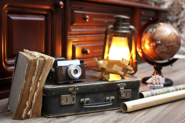 istock composition on a wooden floor vintage globe with old leather sui 852882144