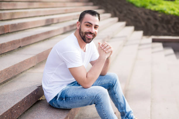 istock Man Relaxing Outside. waiting on the stair 852894070