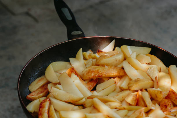 istock Fried potatoes in a frying pan 852902890